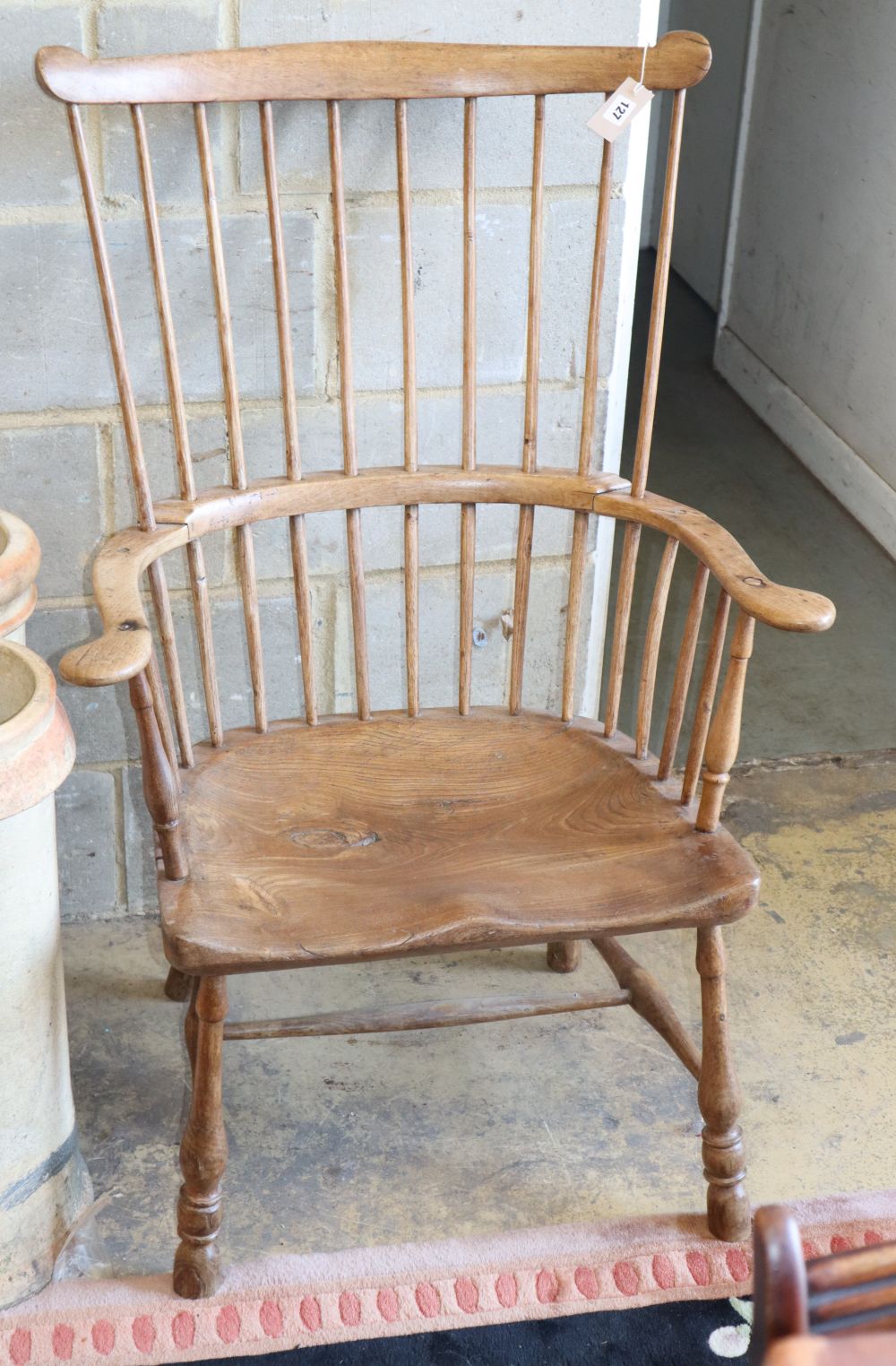 A 19th century elm and ash comb back chair, W.74cm, H.110cm